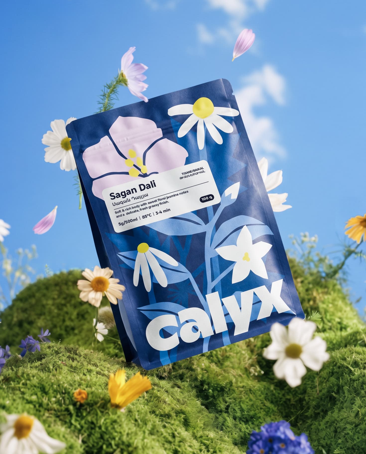 Calyx tea pouch among flowers in a meadow.